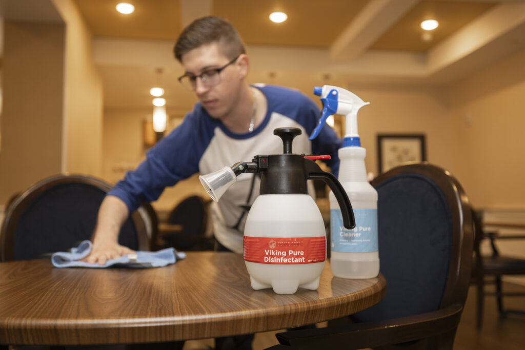 Dalton Penta with The Wellington Senior Living using the Viking Pure products on a wooden table